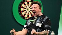 World Darts Championship: Callan Rydz keeps up perfect record to reach last 16