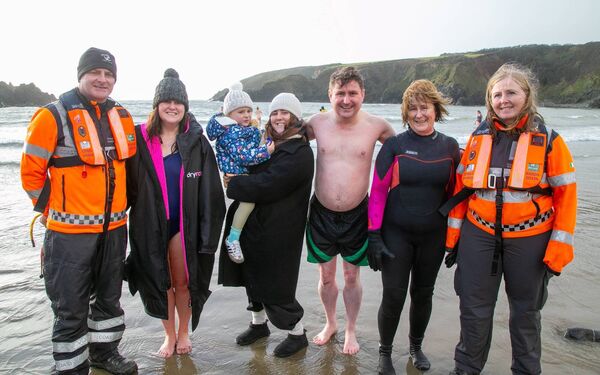 Swimmers and Coastguard volunteers taking part in the swim. Photo: John Power Swimmers and Coastguard volunteers taking part in the swim. Photo: John Power