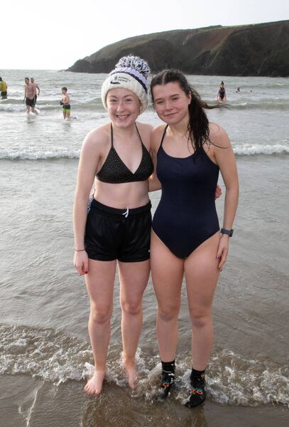 Two swimmers braving the elements at this year's swim. Photo: John Power Two swimmers braving the elements at this year's swim. Photo: John Power