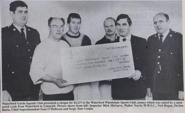 Waterford Garda Squash club present a cheque to the Waterford Wheelchair Sports Club Waterford Garda Squash club present a cheque to the Waterford Wheelchair Sports Club