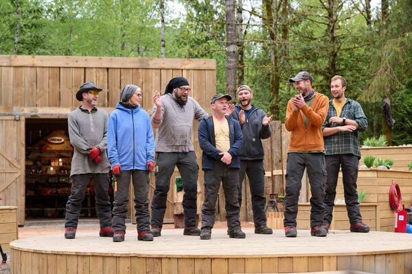 John pictured with contestants on the show 