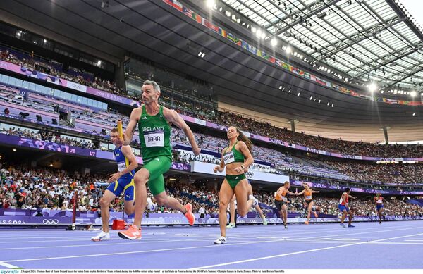 2 August 2024; Thomas Barr of Team Ireland takes the baton from Sophie Becker of Team Ireland during the 4x400m mixed relay round 1 at the Stade de France during the 2024 Paris Summer Olympic Games in Paris, France. Photo by Sam Barnes/Sportsfile 2 August 2024; Thomas Barr of Team Ireland takes the baton from Sophie Becker of Team Ireland during the 4x400m mixed relay round 1 at the Stade de France during the 2024 Paris Summer Olympic Games in Paris, France. Photo by Sam Barnes/Sportsfile