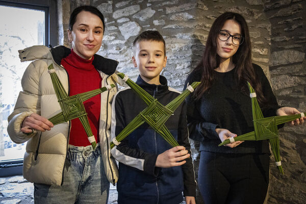  Nataliia, Olek and Iryna, with the St. Brigid's Crosses they made at a workshop in Reginald's Tower.