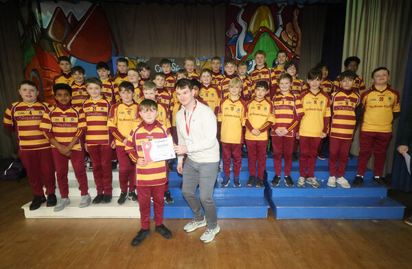  Mr. Morrissey prersented a certificate to Brody on behalf of the St. Declan;s team, at the Primary Teachers Promoting Chess, competition at Mount Sion Primary School Hall. Photo: Joe Evans