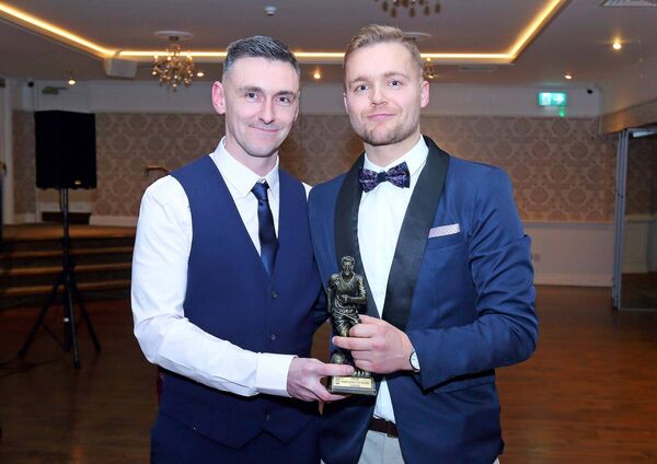Niall O'Toole presents the Tycor FC Premier Player of the Year award to Glenn Hawe.