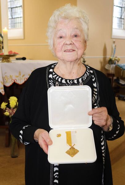 The Benemerenti Meadal was presented to Mae Mc Grath for her services to the choir at Ballybricken Churc. Photo: Joe Evans