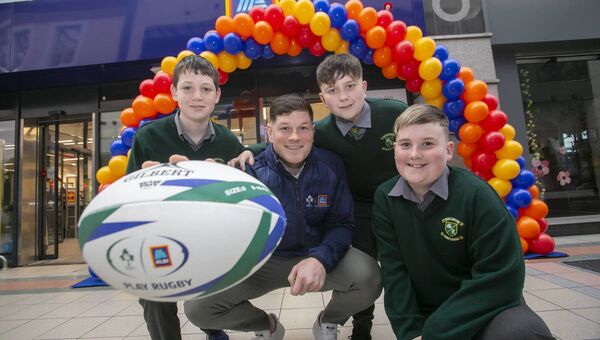 Schoolchildren from Scoil Lorcáin N.S. with Ireland and Munster rugby player Jack O’Donoghue at ALDI’s newly opened store in Waterford. Photograph: Patrick Browne