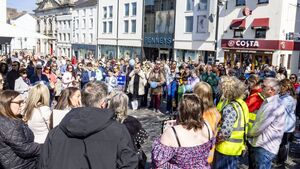 'Let them in!'- Scores gather in city for protest