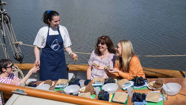 Sarah Browne hosting the Oysome Irish Oysters Masterclass with guests Máiread Foley, Lorraine Spillane, and Mary Geary onboard the Klevia at Dungarvan Quay during the Waterford Festival of Food. The event was led by Sarah, an Irish oyster expert and member of the Oyster Master Guild. The festival runs until Sunday. Photo: Joleen Cronin