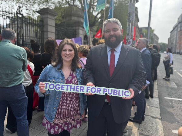 Waterford Sinn Fén TD Conor D. McGuinness at the Campaign for Public Childcare protest alongside main organiser Rachel Coyle of the National Women’s Council. 