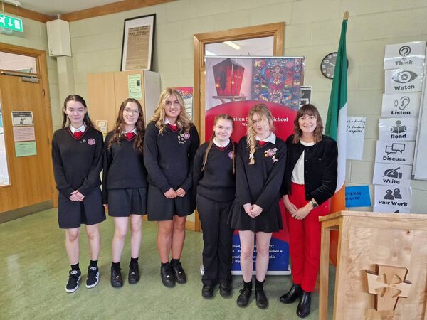 Ambassador Hickey is pictured with 5th-year students following the talk. 