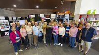 Crowds gather at photo exhibition in Waterford telling the story of Ireland in 2024