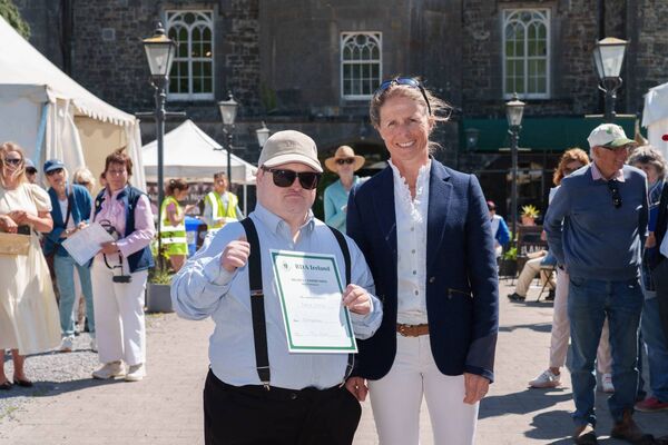 Pictured at the Garden Party to honour volunteers were service user, Patrick, from the Calliaghstown group along with Sarah Ennis, Olympian and renowned Irish Eventing Rider.