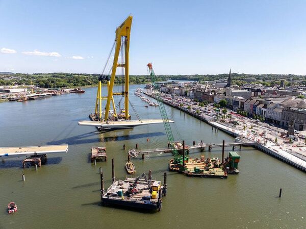 The second span of the Sustainable Transport Bridge is carried towards its final position. Pic: Peter Grogan.