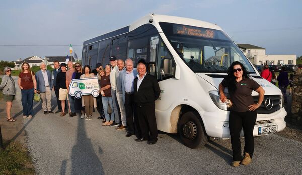 Bus Driver, Carla Cabaco with members of the local community celebrate the 358 TFI Local Link bus route as it stopped off at one of its new stops at Carbally Community Centre. Photo: Joe Evans