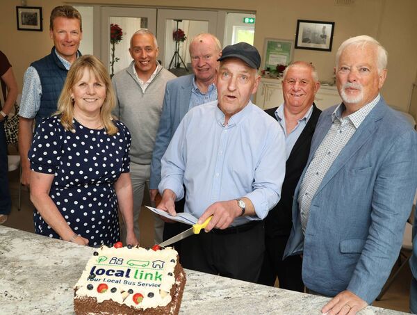 Tommy Keogh cuts the cake to celebrate the new 358 TFI Local Link bus route as it stopped off at one of its new stops at Carbally Community Centre. Photo: Joe Evans