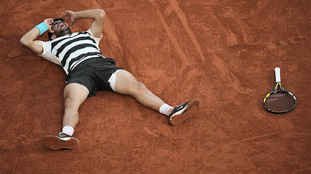 Carlos Alcaraz defends French Open title after epic tussle with Jannik Sinner