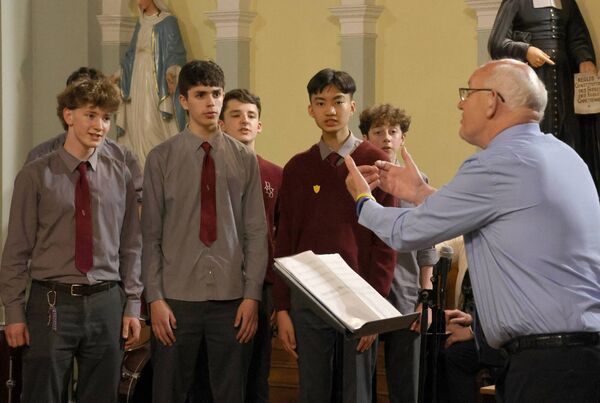 Br. Ben takes charge of the Senior Choir, at the De La Salle Summer Concert.