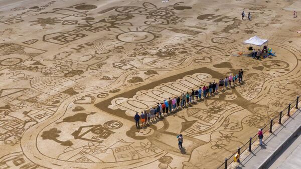 Foster families create colossal beach art in Tramore (pictured) and Duncannon to inspire fostering within the community. Photo Nichola Browne-Sinnott. Foster families create colossal beach art in Tramore (pictured) and Duncannon to inspire fostering within the community. Photo Nichola Browne-Sinnott.