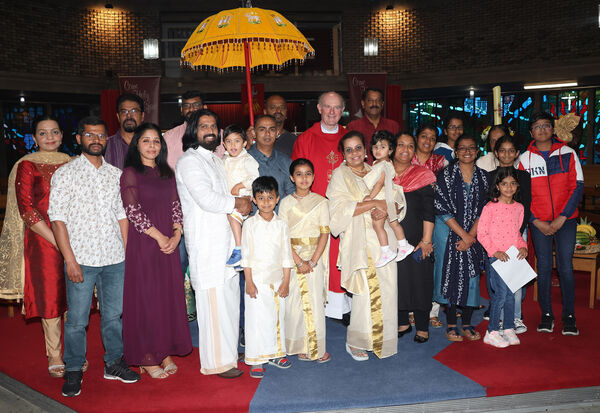  Fr. Liam Power with members of the Indian community at the Pentecost Sunday Celebration at St. Joseph and St Benildus Church.