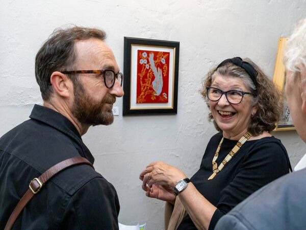 Mór Artists Collective Members Paudrig Lee and Annie Shaw looking at Annie's egg tempera painting, at the Launch of Mór Collective Art Exhibition at Fota House