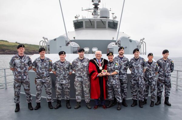  LT/CDR Aisling O'Flynn, Officer Commanding LÉ Aoibhinn making a presentation to Cllr. Joe Kelly, Metropolitan Mayor to mark the occasion. Included are crew members. Photo: John Power