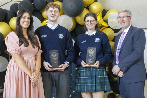  Ms Fleming and Mr. Cawley, Principal, presented awards to Head Boy and Girl, Leon Murphy and Aoife Milner, at the Ardscoil Na Mara sixth year graduation ceremony.