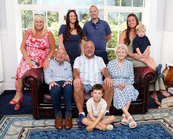  Tom and Evelyn Collins pictured with their son John and his family.