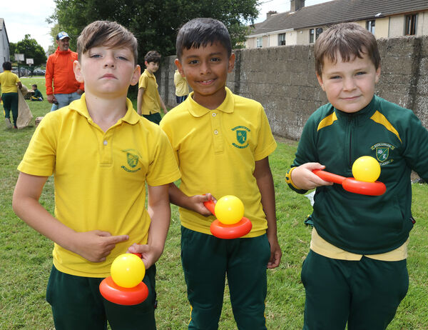  Pierce, Alvin and Aaron, enjoy the 2nd class egg and spoon challenge at the Scoil Lorcain end of term fun day.