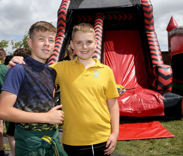  Johnny and Tommy, fifth class pupils, waiting for their turn on the bouncy castle at the Scoil Lorcain end of term fun day.