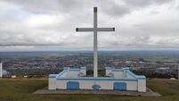 Emergency services attend to injured walker at Holy Year Cross