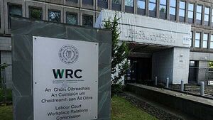Cleaner accused of taking photos of overweight colleague awarded €12,500 for unfair dismissal Cleaner accused of taking photos of overweight colleague awarded €12,500 for unfair dismissal