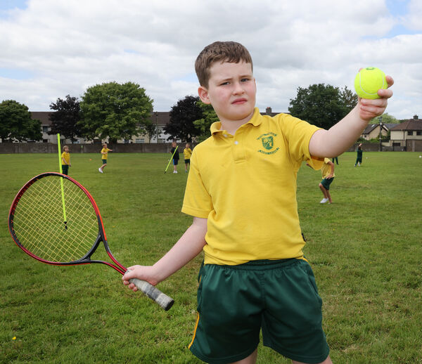 Cillian took part in the first class rounders challenge at the Scoil Lorcain end of term fun day.