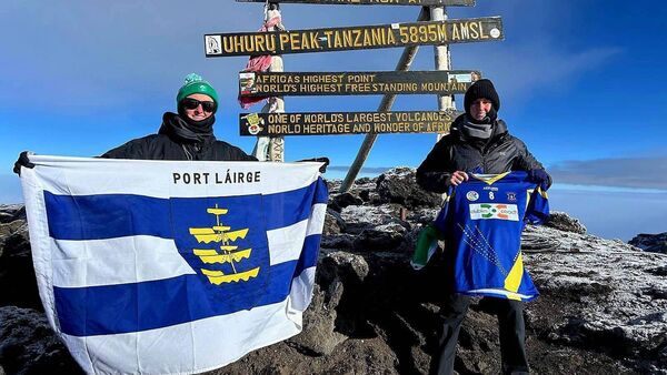 Proud sisters fly the Waterford colours on top of world's highest free-standing mountain