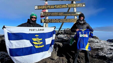 Proud sisters fly the Waterford colours on top of world's highest free-standing mountain
