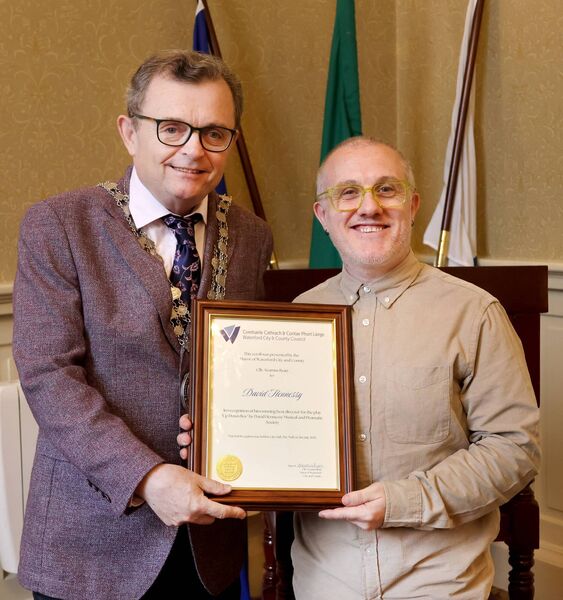 Mayor of Waterford City &amp; County Cllr Seamus Ryan presenting a scroll to David Hennessy, in recognition of him winning best director for 'Up Down Boy'. Photo: Joe Evans