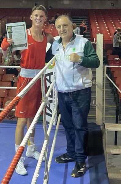 Michael Reilly receives his medal and cert from High Performance Head Coach, Zaur Antia after his 55kg win over Edward Corcoran at the National Boxing Arena on Friday last.