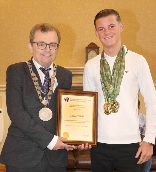 Mayor of Waterford City &amp; County Cllr Seamus Ryan presenting a scroll to Michael Reilly, in recognition of his many outstanding accomplishments as a National and International Boxer. Photo: Joe Evans
