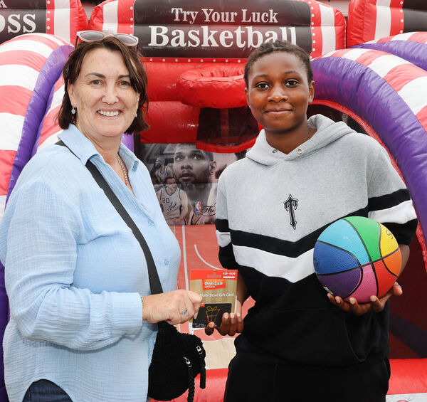  Sarah Jane Duggan, presented a voucher to Basketball Champ, Paul Ajayi, at the Ballybeg Fun Day as part of the estates 50th Year Anniversary. Photo: Joe Evans