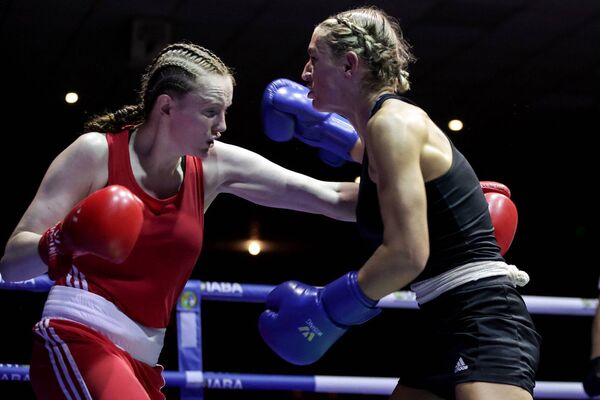 Waterford and Tramore boxer Zara Breslin (red) in action recently against Kellie McLoughlin. Photo: INPHO/Laszlo Geczo Waterford and Tramore boxer Zara Breslin (red) in action recently against Kellie McLoughlin. Photo: INPHO/Laszlo Geczo