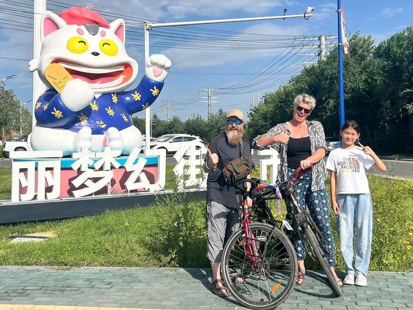 On yer bike: Waterford couple Mark Graham and Ellie O'Byrne in China after pedalling all the way there. 