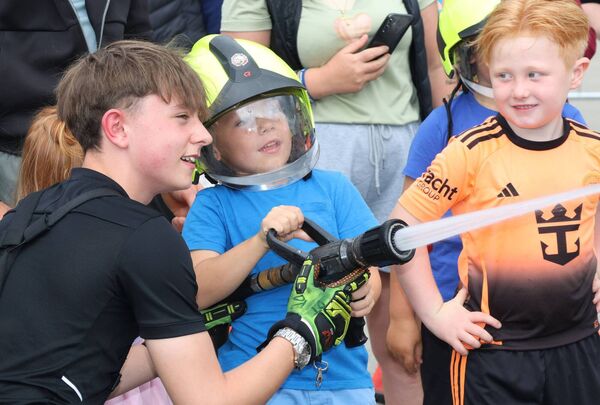 Luke Myler teaching how to put out fires at the Waterford Fire Station open day. Photo: Joe Evans