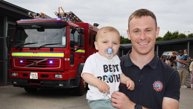 <p>Rian and Adam, pictured at the Waterford Fire Station open day. Photo: Joe Evans</p>