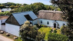 Two homes for the price of one: Thatched cottage and bungalow on sale together Two homes for the price of one: Thatched cottage and bungalow on sale together