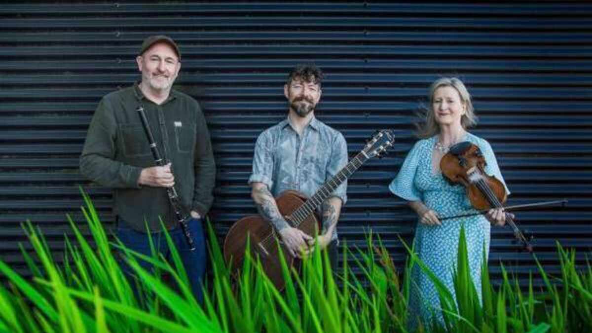 Exciting trio of musicians playing in Garter Lane