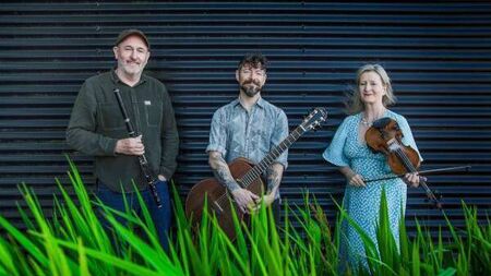 Exciting trio of musicians playing in Garter Lane