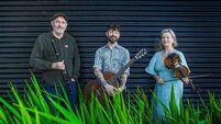 Exciting trio of musicians playing in Garter Lane