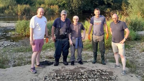 Some of the anglers pictured with just some of the fish killed. Pic: Federation of Irish Salmon &amp; Sea Trout Anglers FB