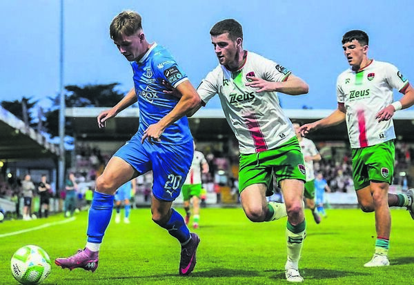 Waterford FC’s Conan Noonan tries to fend off the challenge of Cork City’s Darragh Crowley during their Sports Direct FAI Cup clash at Turner’s Cross on Friday last. 