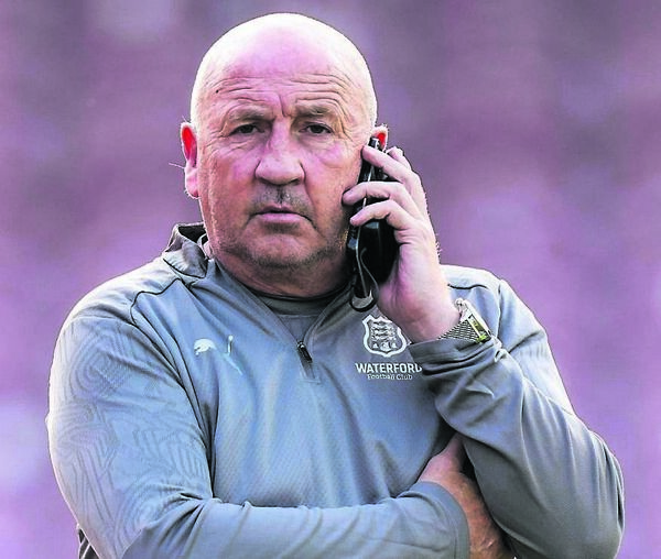 Waterford FC manager John Coleman takes a phone call prior to the FAI Cup game against Cork City.